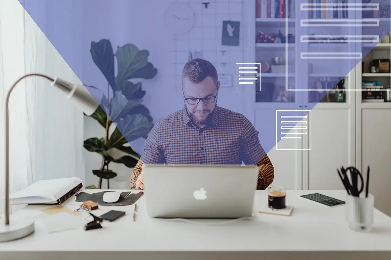 man-with-glasses-using-his-laptop-and-sending-emails